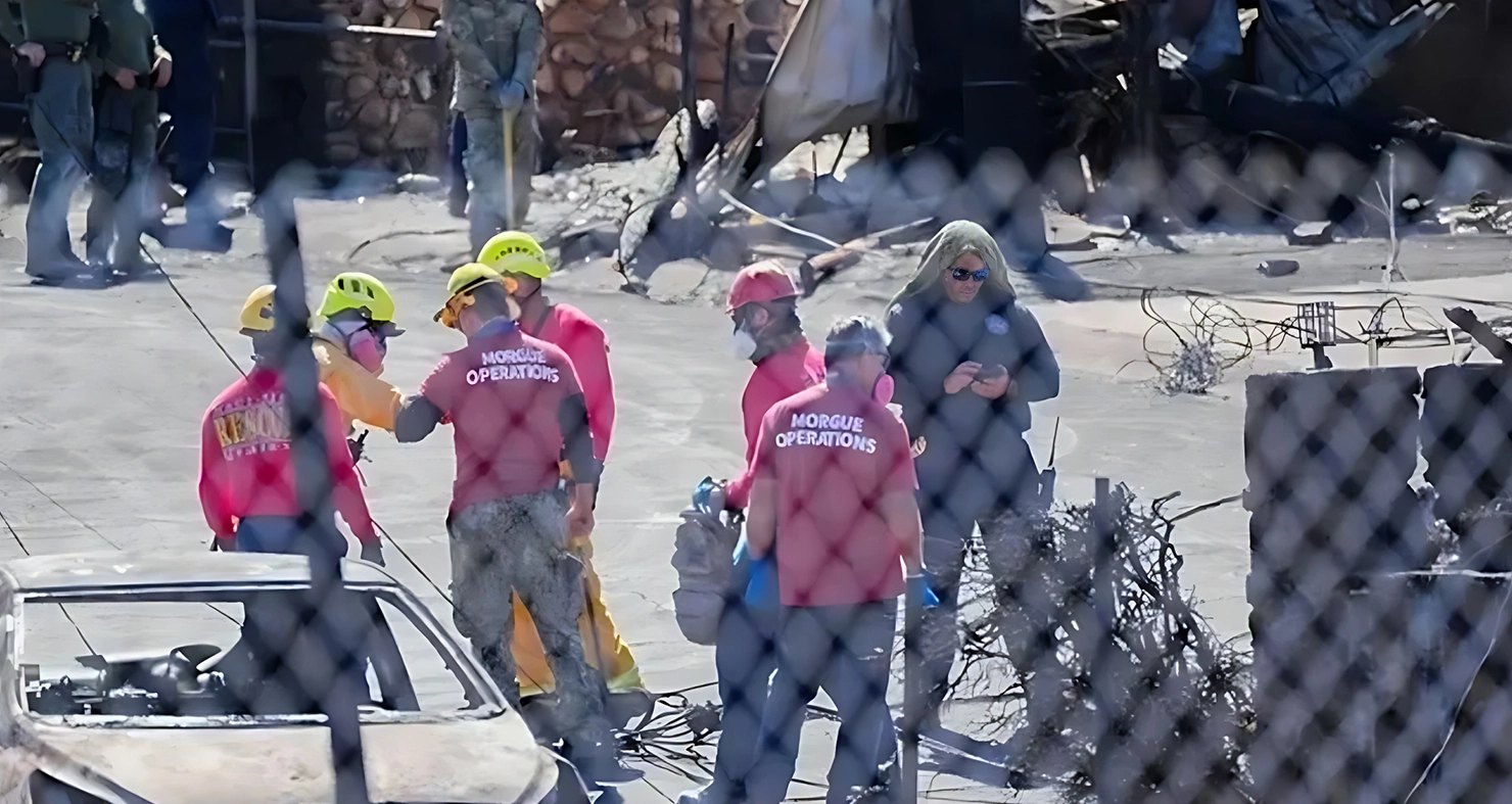 A group of people in red shirts and helmets.